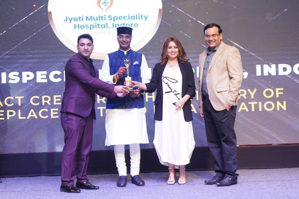 Medical excellence award ceremony honoring achievements in orthopedic and healthcare services at a hospital event in Indore.